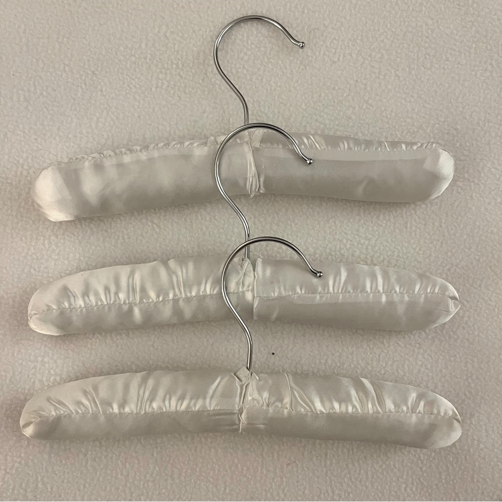 Set of 3 White Satin Baby Hangers.
